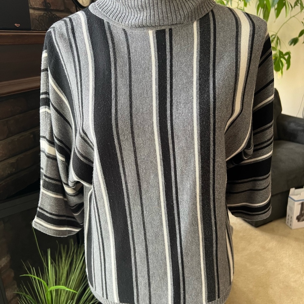 Light weight sweater. Gray, black and white.